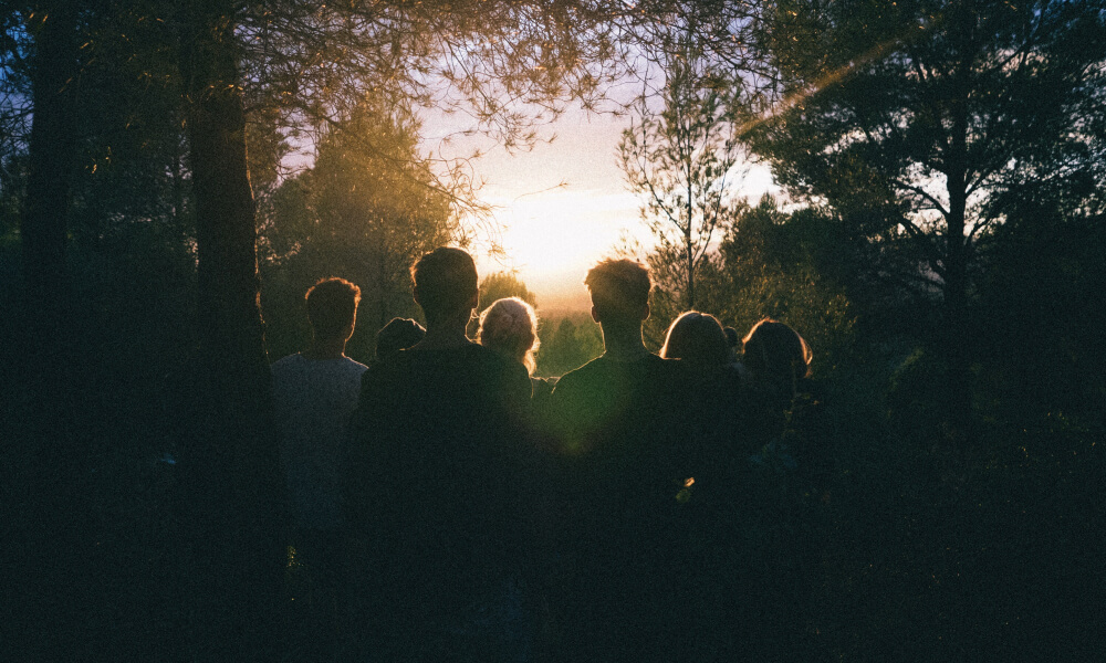Picture of a small group of people in a wooded area